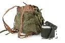 Authentic Romanian military surplus bundle featuring an olive drab canvas rucksack, M73 steel helmet, and two-piece aluminum mess kit.