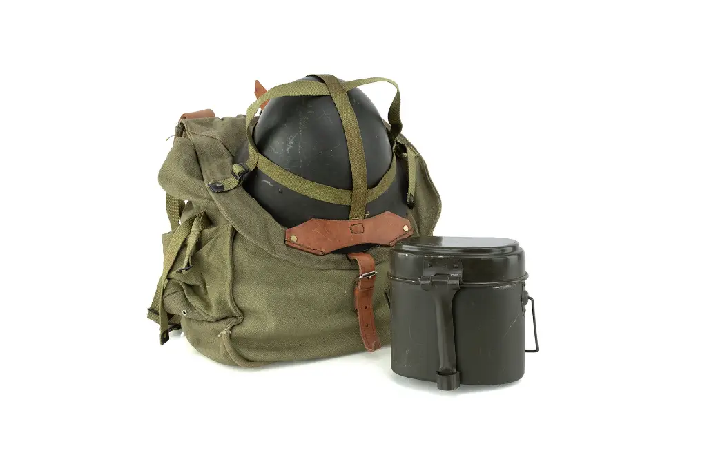 Authentic Romanian military surplus bundle featuring an olive drab canvas rucksack, M73 steel helmet, and two-piece aluminum mess kit.