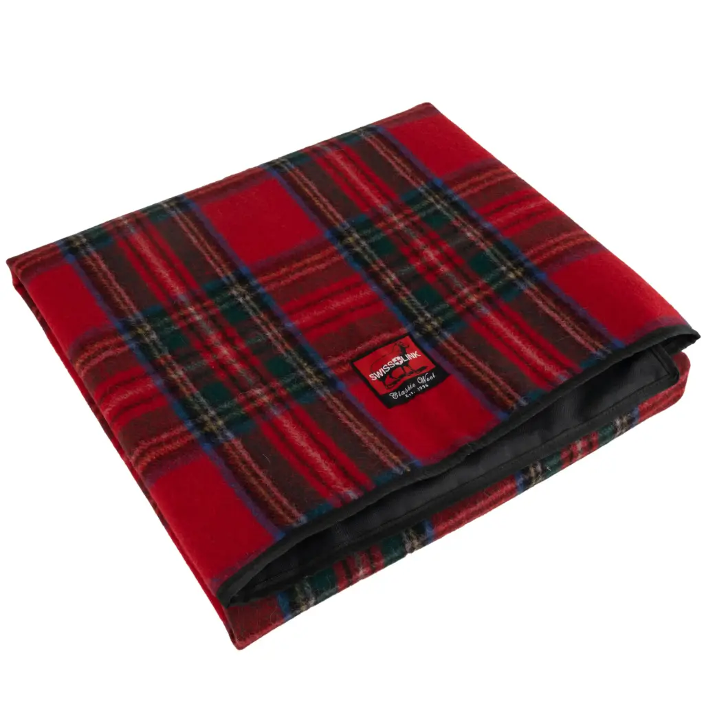 Classic Wool picnic blanket in red plaid, folded, showing waterproof backing
