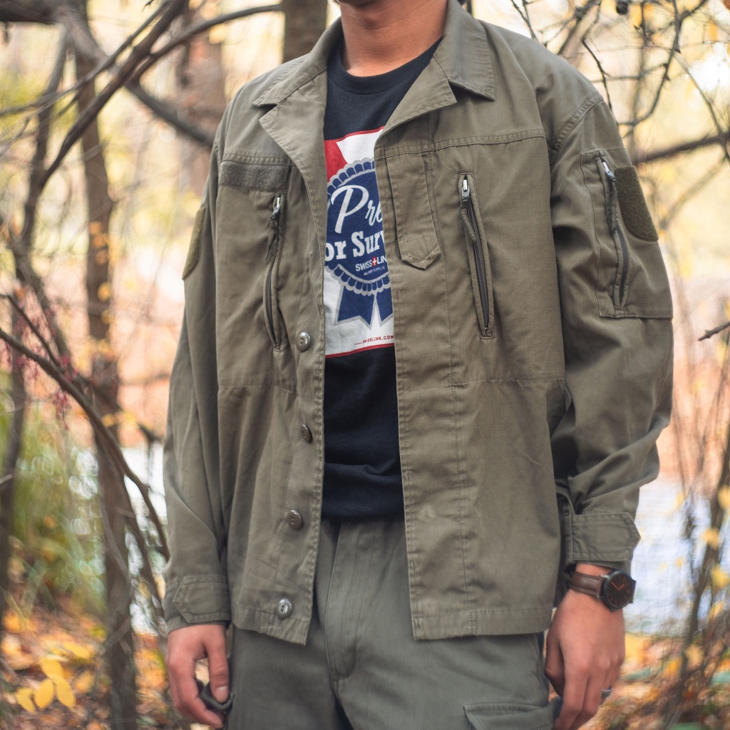 Austrian mountain troop ripstop jacket in olive drab, worn outdoors